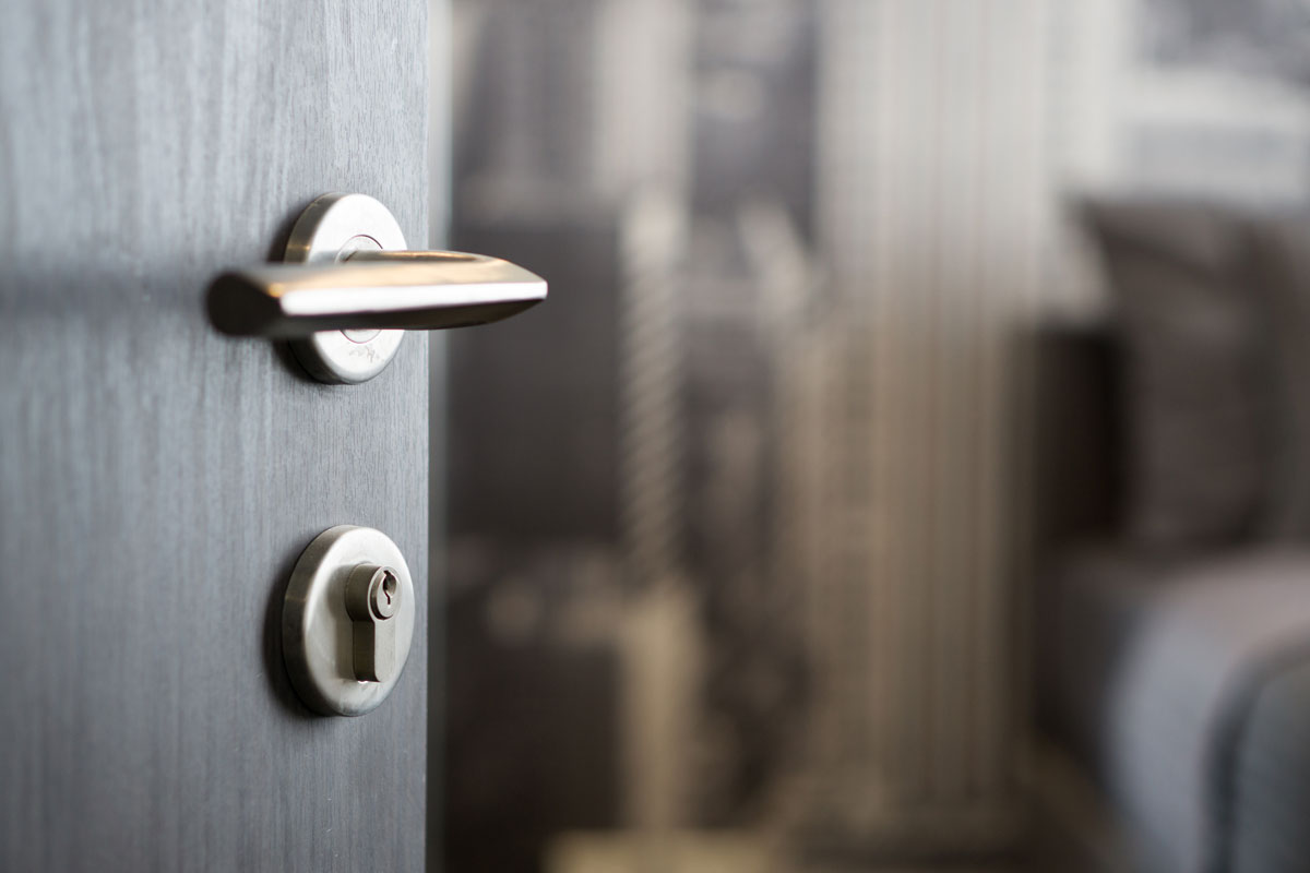 How long does COVID-19 last on surfaces such as door handles or lift buttons?